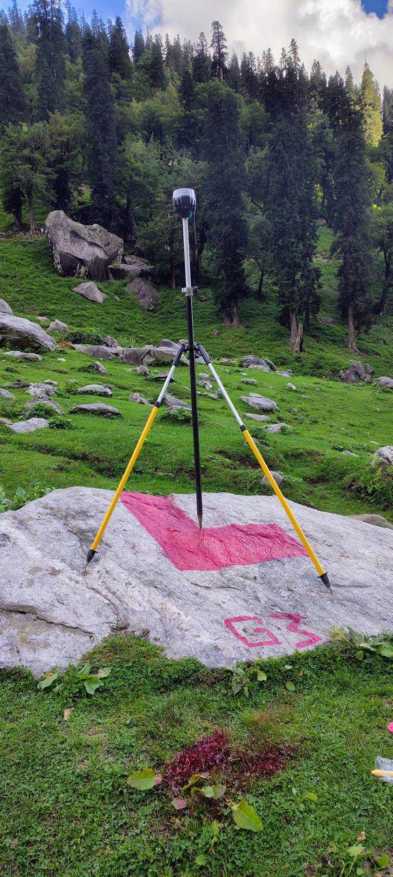 DGPS base station on a painted control point in an alpine meadow
